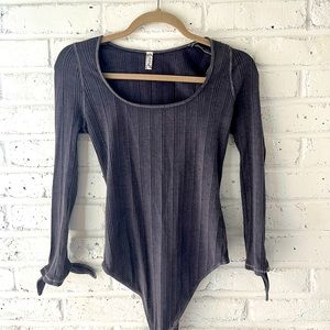 Free People body suit. Brand new - never worn. Size small.